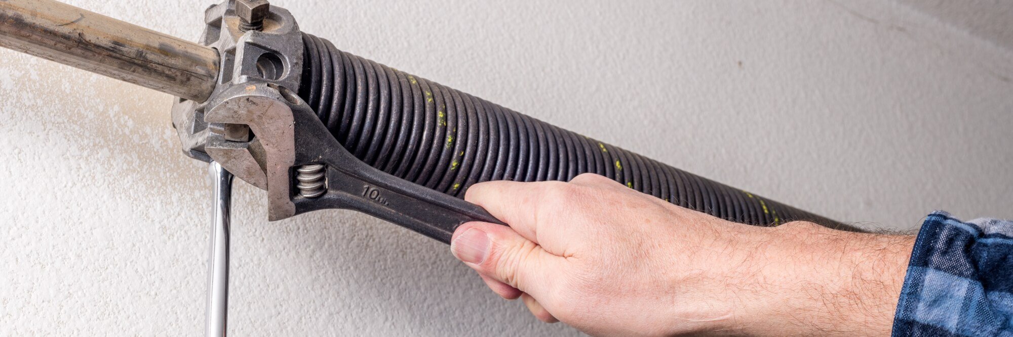 Workers installing garage door automation system