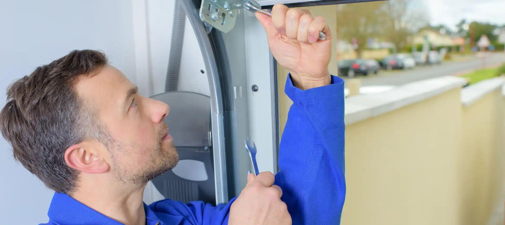 professional doing a garage door repair